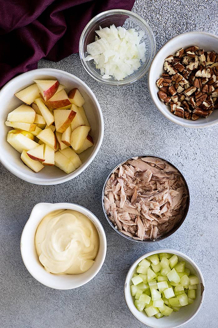 Ingredients needed to make apple tuna salad.