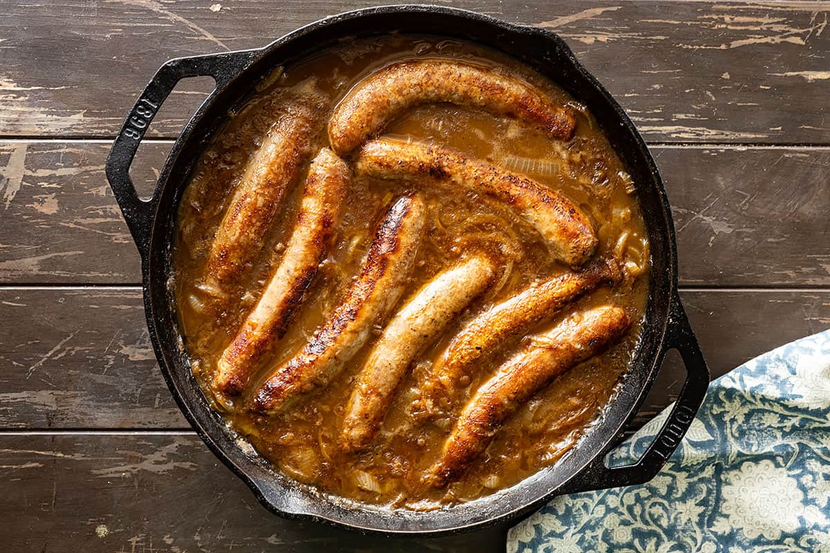 Sausages in onion gravy fresh from the oven and ready to eat. 