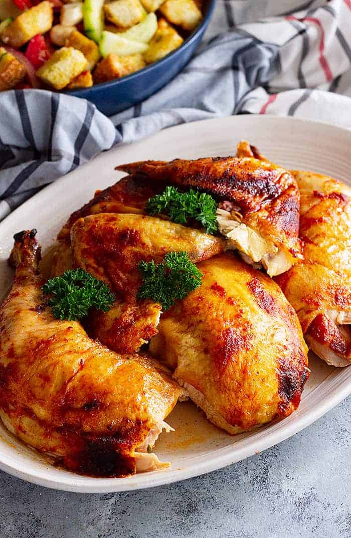 overhead: a plate of cooked beer butt chicken with crispy skin
