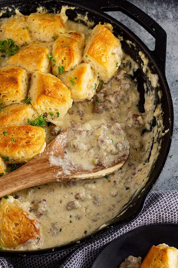 Close up of the gravy part of biscuit and gravy casserole.
