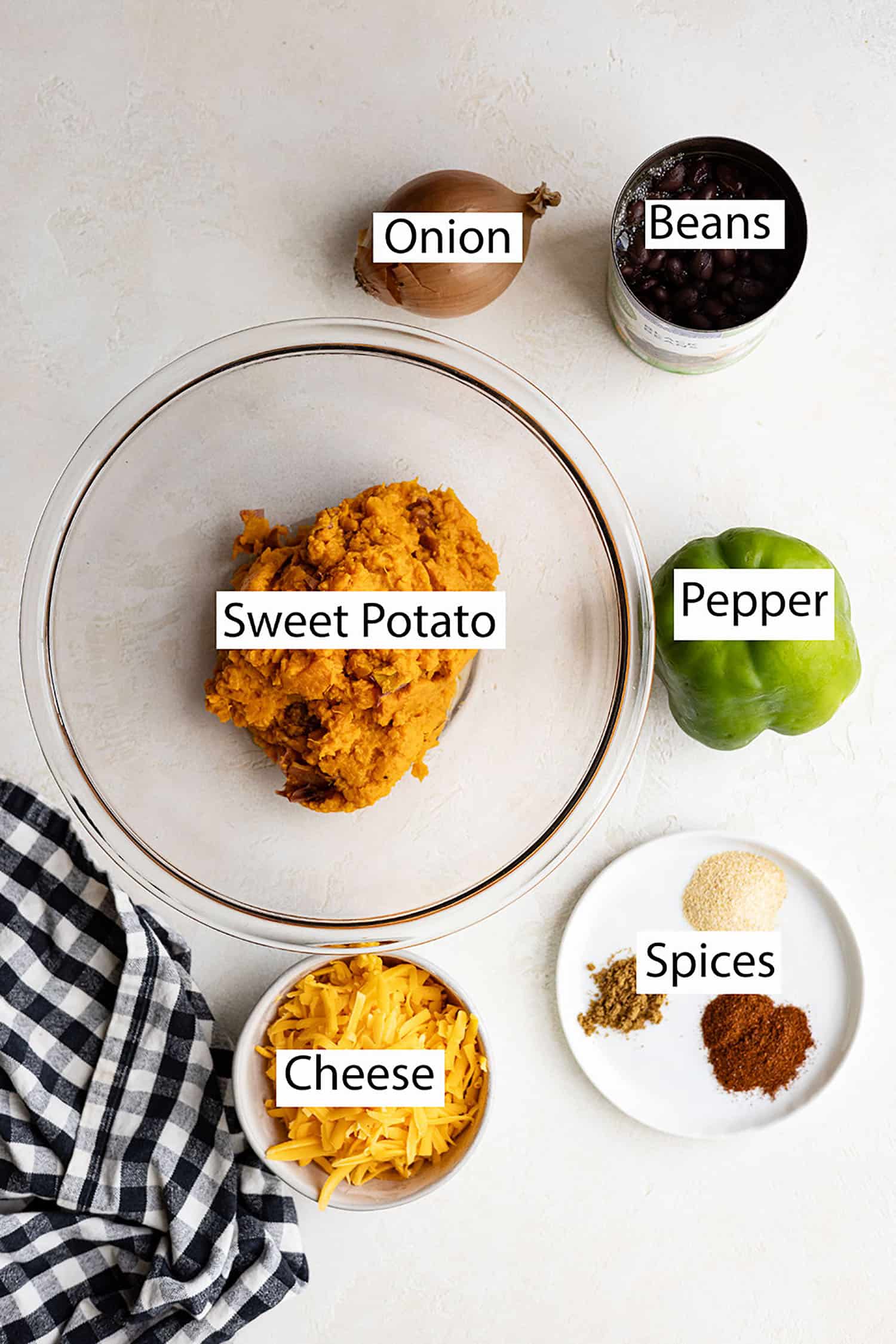 Ingredients: sweet potato, onion, beans, bell pepper, cheese, spices. 