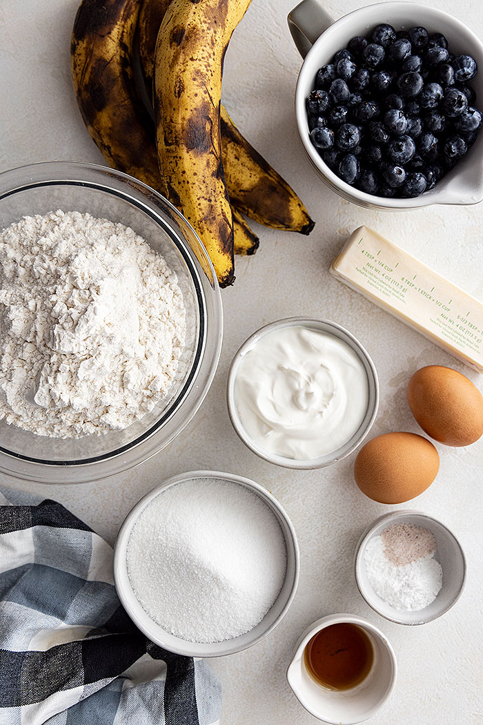 Overhead view of all the ingredients to make blueberry banana muffins. 