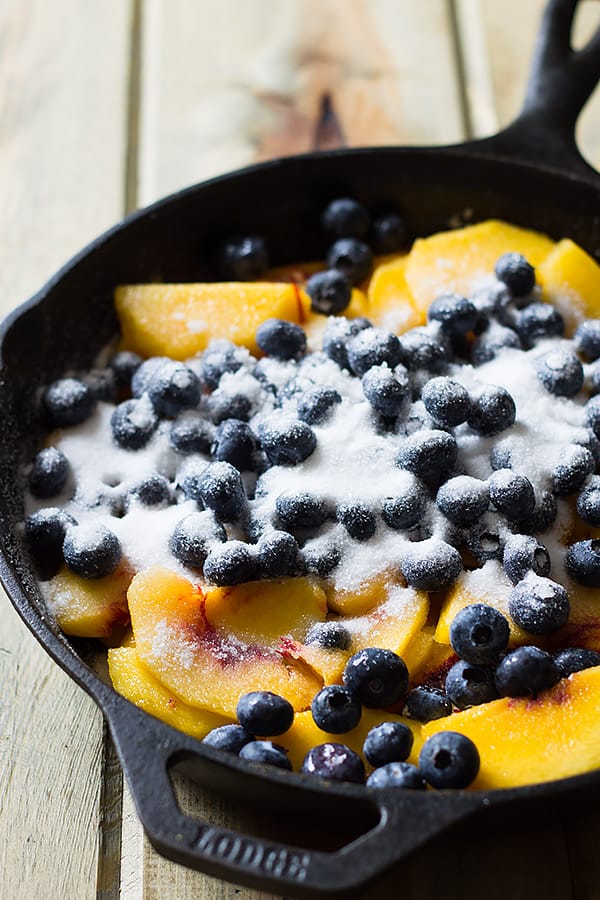 Blueberry Peach Cobbler -an easy recipe made with fresh peaches and blueberries baked beneath a fluffy biscuit topping! | www.countrysidecravings.com