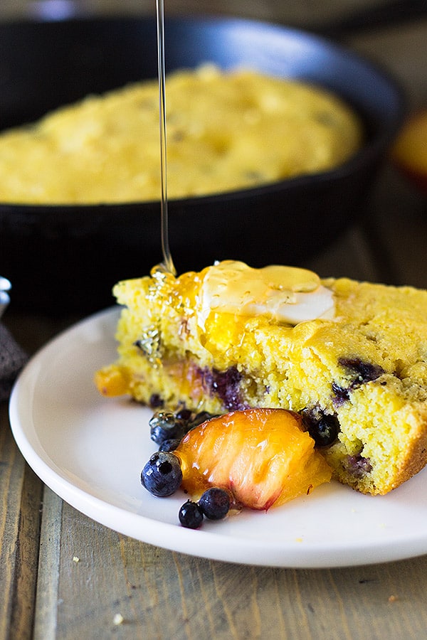 Blueberry Peach Cornbread made with buttermilk, studded with fresh blueberries and peaches will be your new favorite breakfast treat! | www.countrysidecravings.com