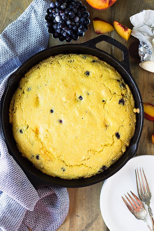 Blueberry Peach Cornbread made with buttermilk, studded with fresh blueberries and peaches will be your new favorite breakfast treat! | www.countrysidecravings.com