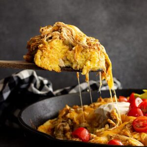 Spoonful of tamale pie being served.