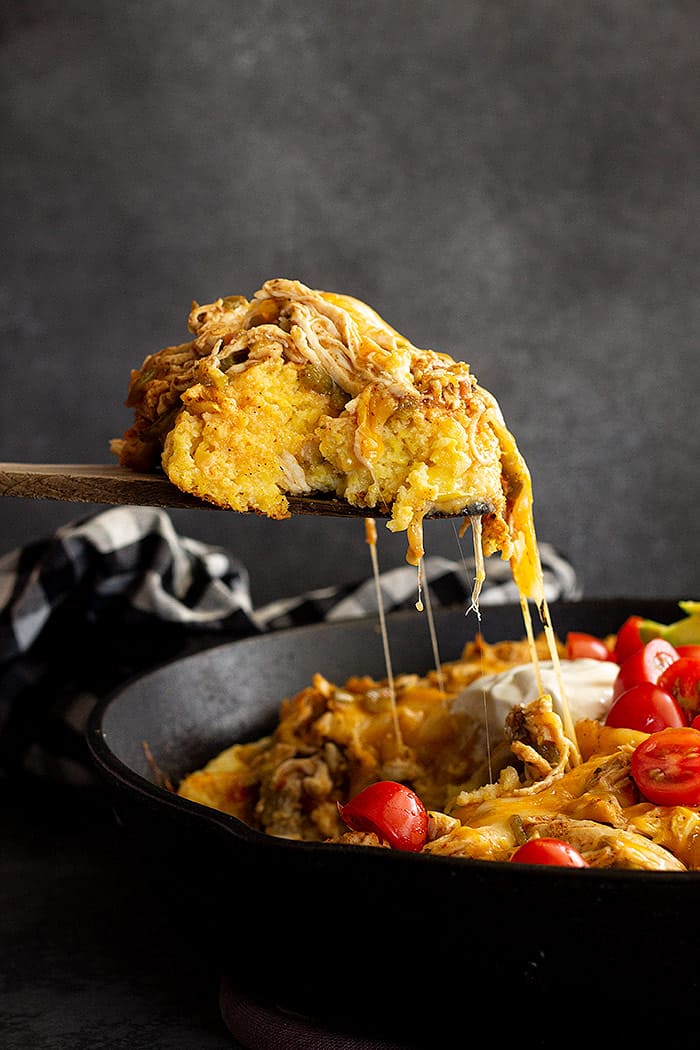 Spoonful of tamale pie being served. 