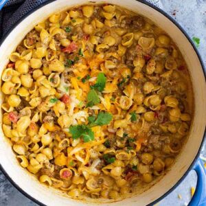Chile Con Queso Mac and Cheese -is a great one pot meal for any night of the week! It's quick and easy (only takes 30 minutes), cheesy, and will become a family favorite!