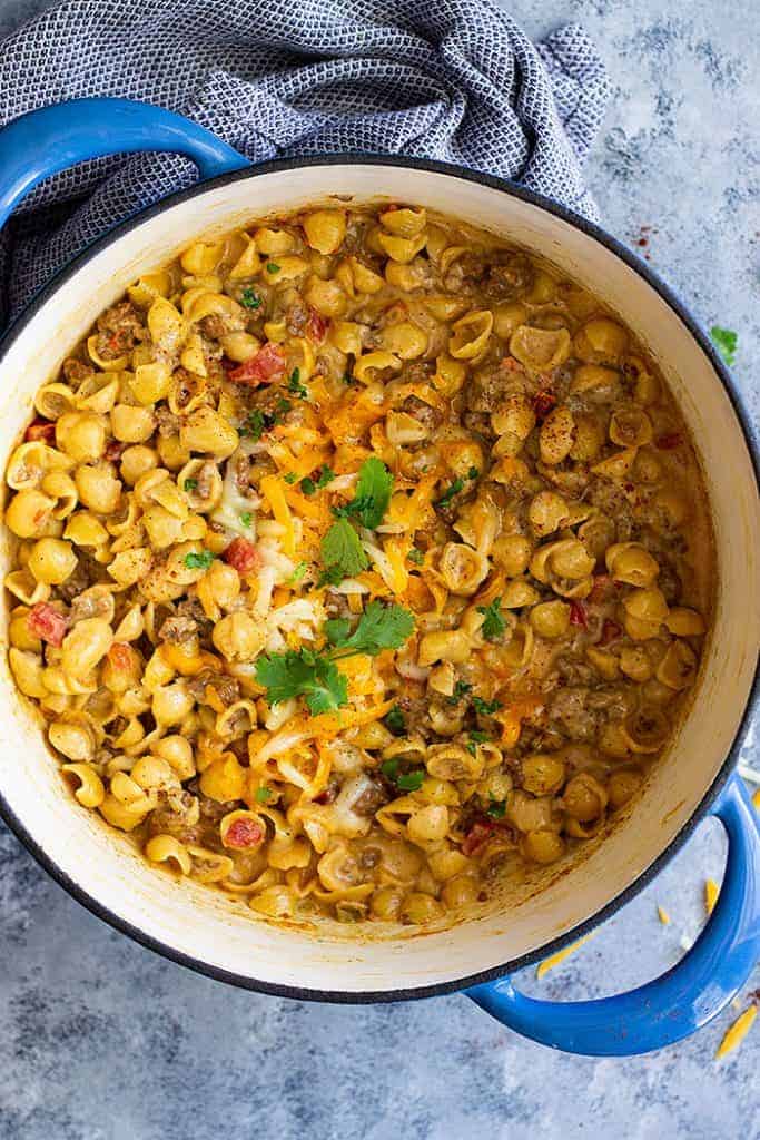 Chile Con Queso Mac and Cheese -is a great one pot meal for any night of the week! It's quick and easy (only takes 30 minutes), cheesy, and will become a family favorite!
