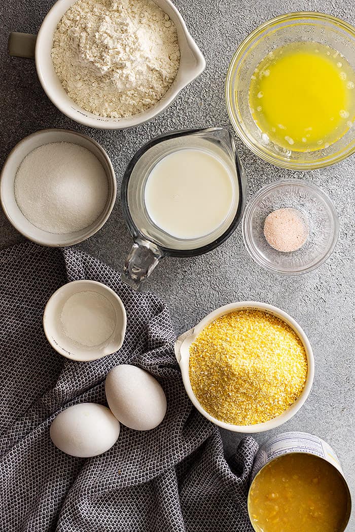 Overhead view of cornbread muffin ingredients all in bowls.