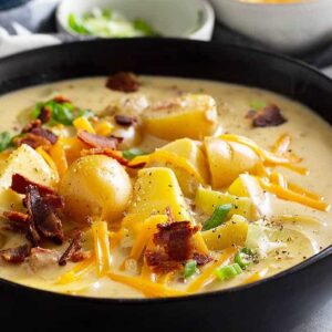 This Creamy Potato Soup is made with no cream soup just easy simple ingredients! It's comfort food that can be on your table in under 30 minutes! #comfortfood #potatosoup