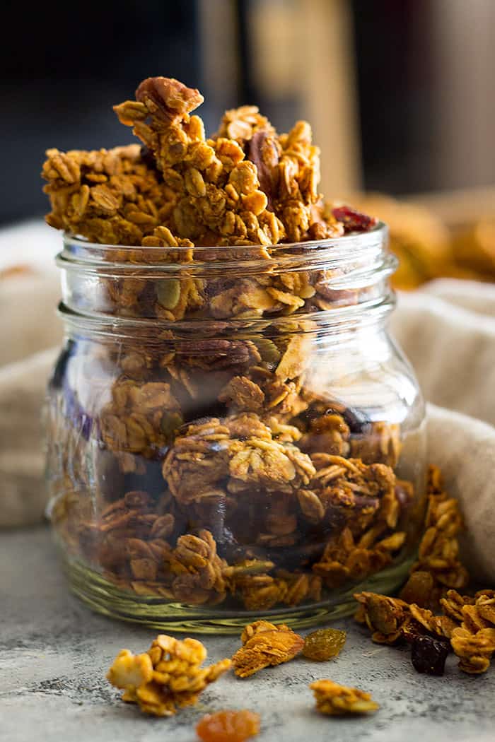 This Crunchy Pumpkin Granola is healthy and delicious! It's made with real pumpkin, coconut oil, dried fruit, nuts and seeds!
