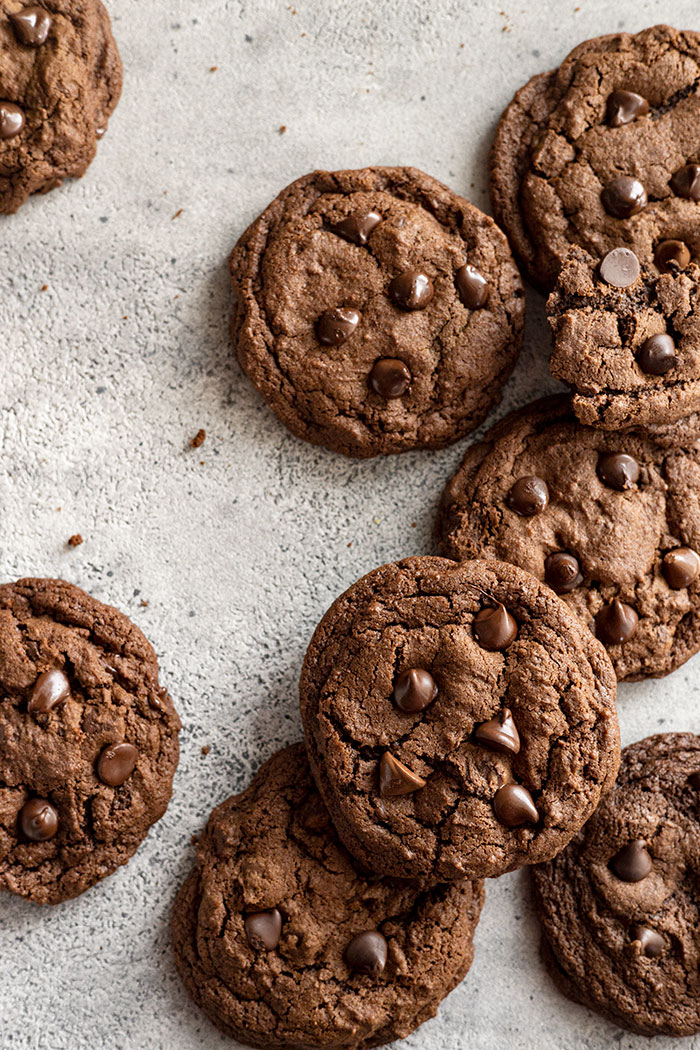 Several cookies stacked and around the frame of the picture.