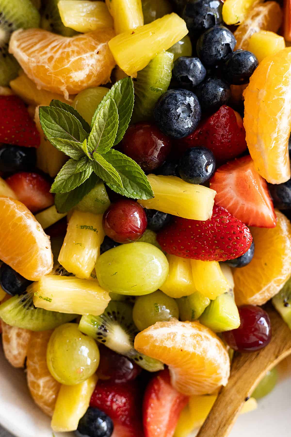 Close up of easy fruit salad. Fresh mint to garnish. 