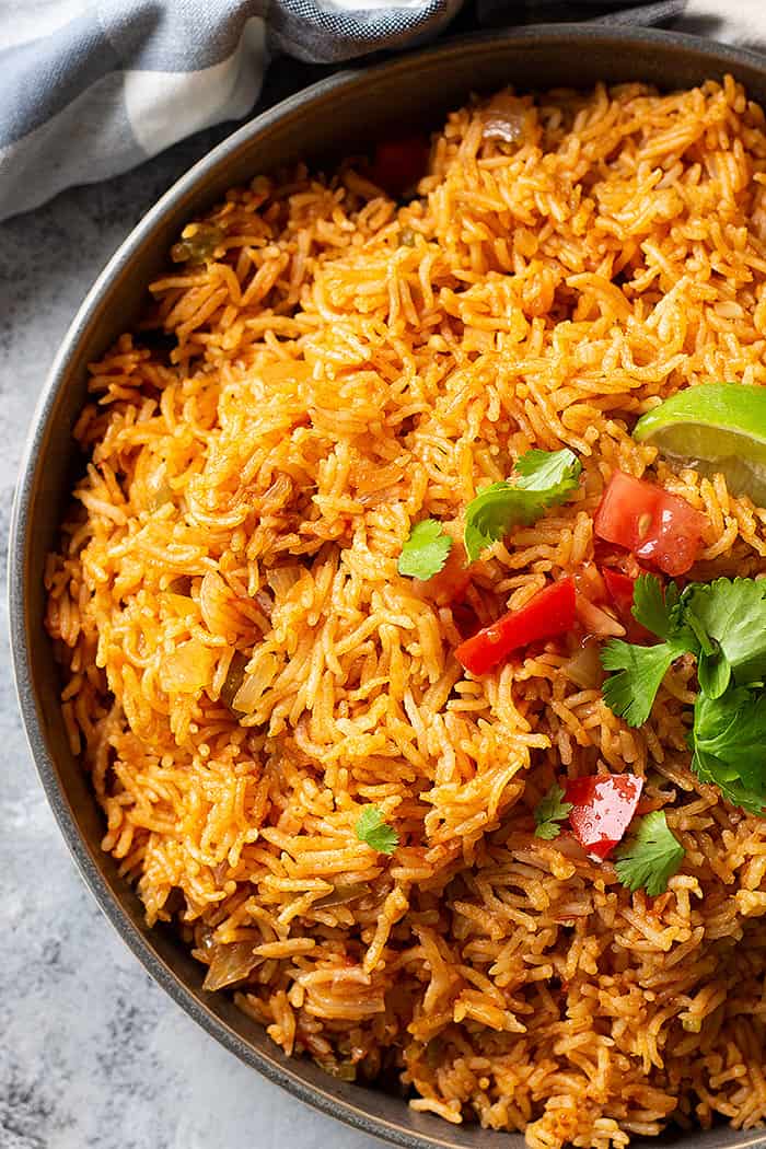 Easy Spanish Rice is the perfect side dish for all you Mexican inspired meals! Instant pot and stove top instructions included! #spanishrice #mexicanrice