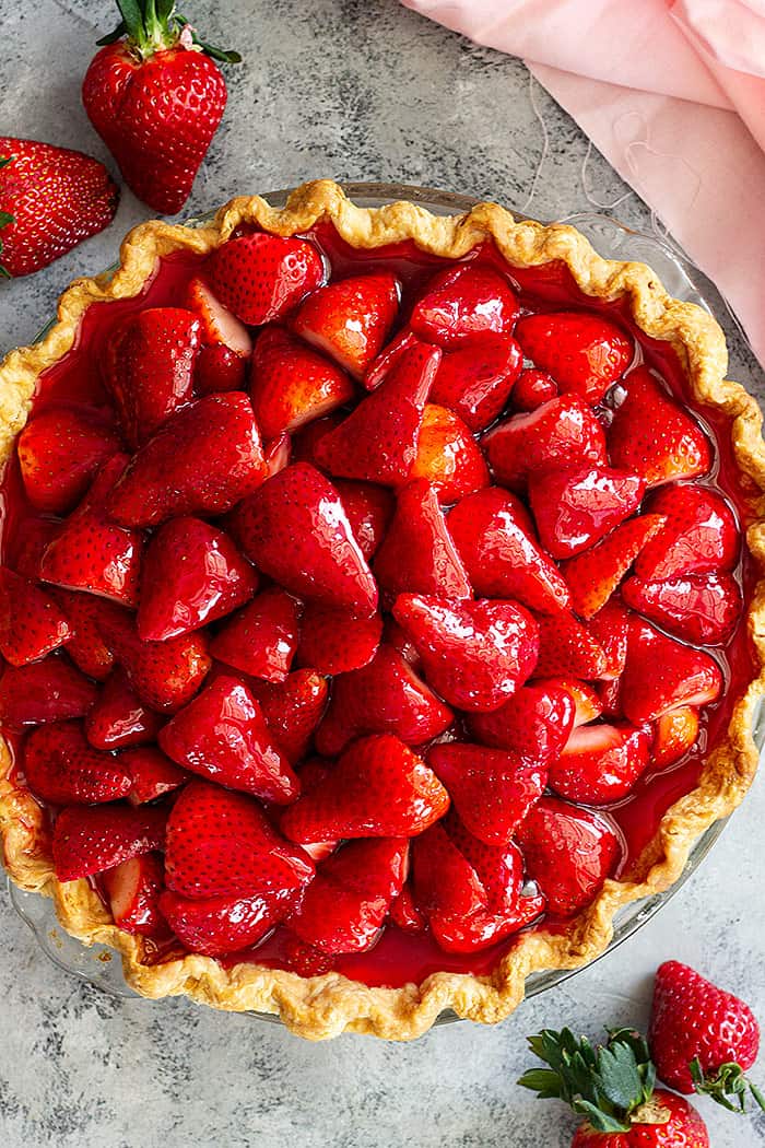 Top down view of a fresh strawberry pie.