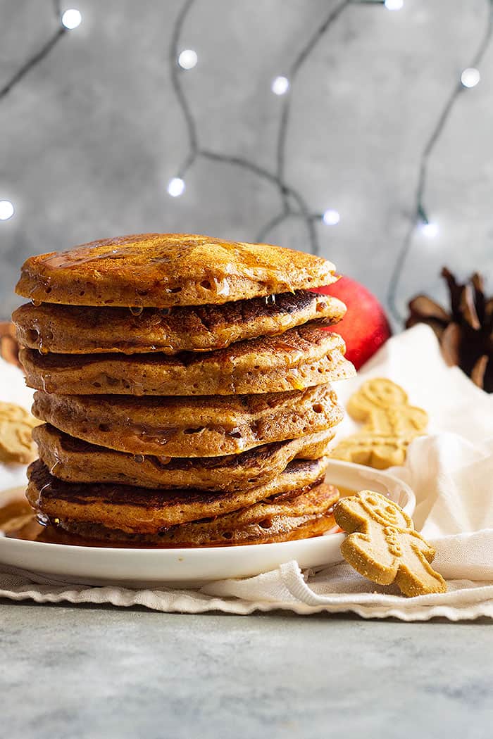 These soft and fluffy Gingerbread Pancakes are spiced just right and taste like a gingerbread cookie!! These will make the perfect Christmas morning breakfast!! #gingerbreadpanckes #christmasmorningbreakfast