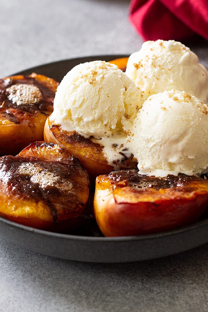Grilled peaches with vanilla ice cream.