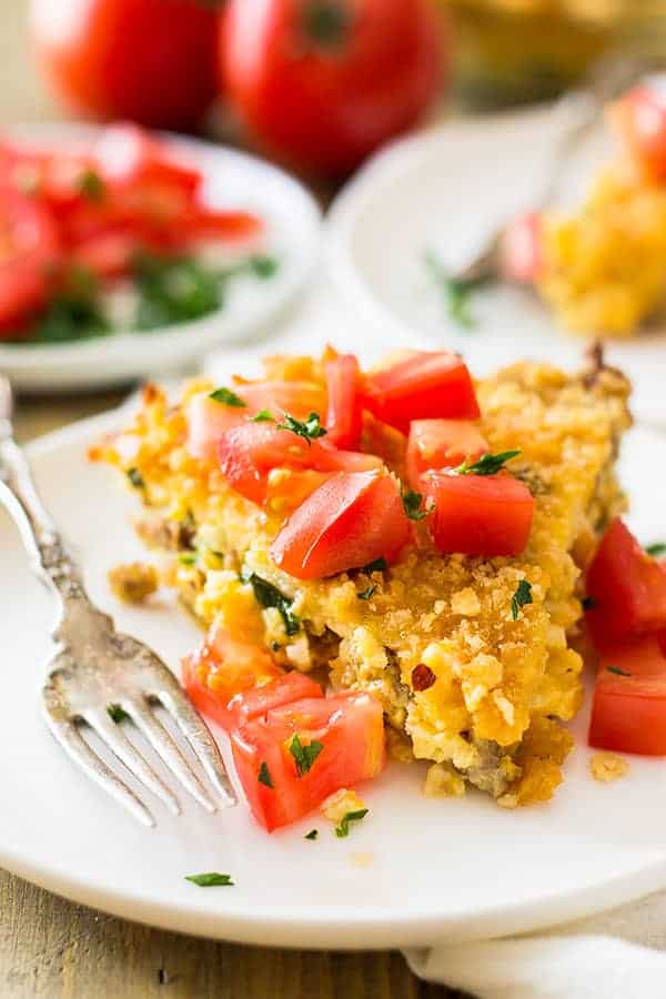 This Hashbrown Sausage Breakfast Pie is filled to the top with breakfast sausage, hashbrowns, 2 cheeses, garlic and a special topping! | www.countrysidecravings.com