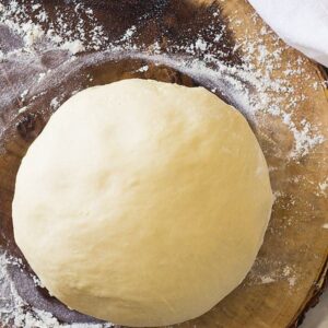This Homemade Pizza Dough will give you a nice thick and chewy crust. It is a great basic pizza dough! | www.countrysidecravings.com