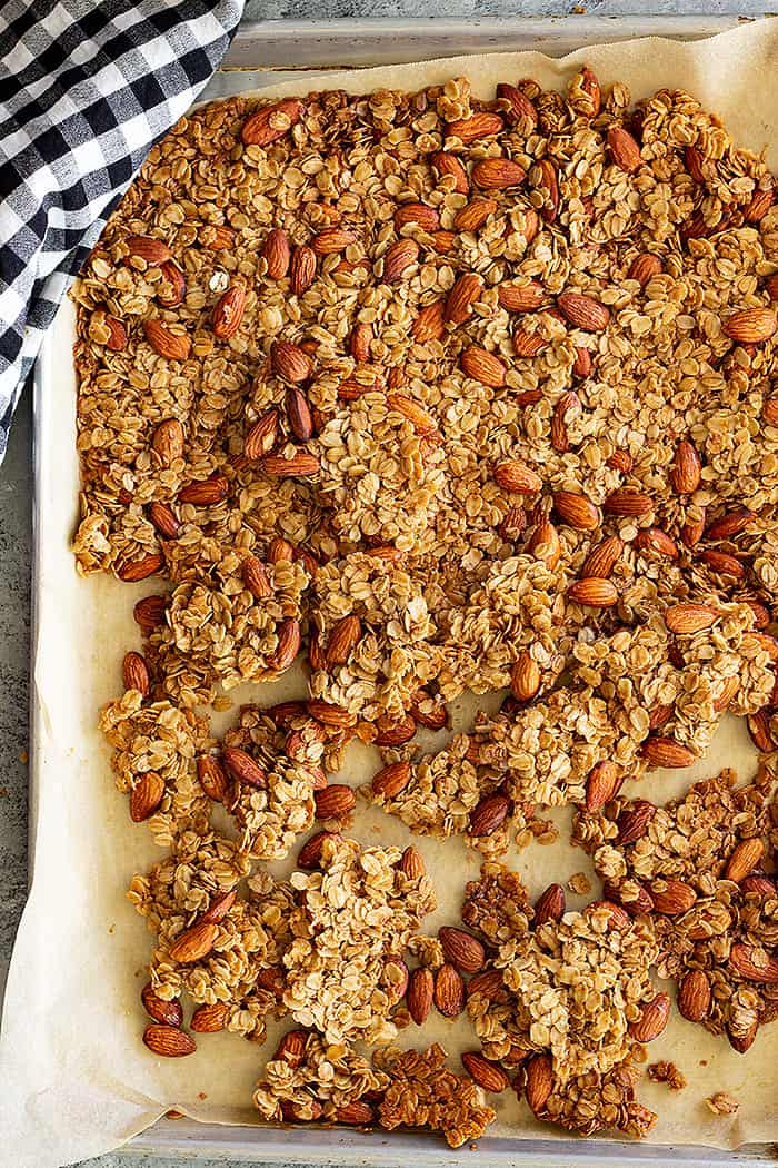 Top down view of granola on a baking sheet. 