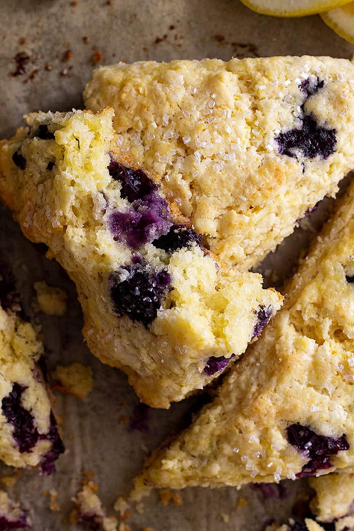 A scone broke open to show the blueberries.