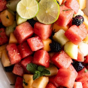 Overhead view of salad on a cream serving platter.
