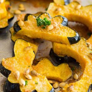This Parmesan Roasted Acorn Squash is an easy savory side dish. It uses simple ingredients and even roasts the seeds!