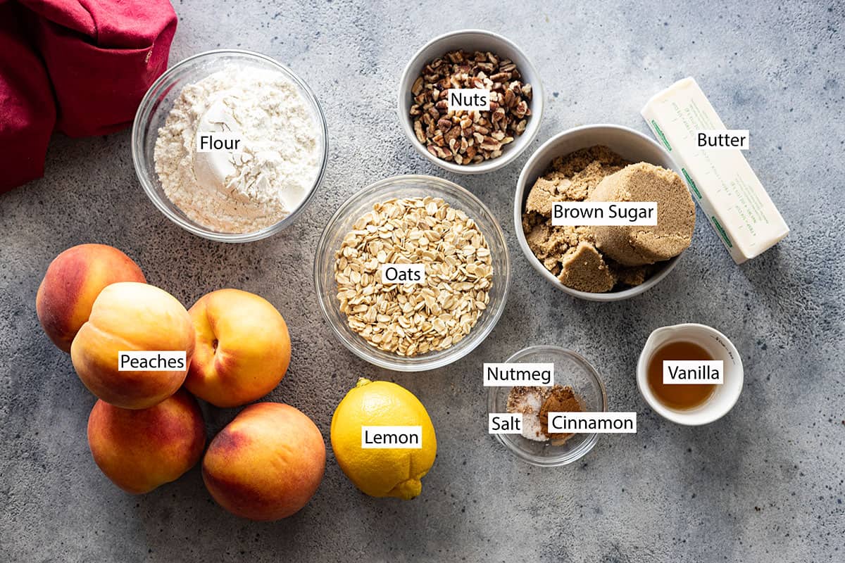 Ingredients: peaches, flour, oats, pecans, brown sugar, butter, cinnamon, nutmeg, lemon, and vanilla.