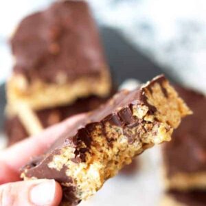 Peanut Butter Cup Rice Krispie Treats -peanut butter flavored rice krispies, studded with mini peanut butter cups, topped with a peanut butter chocolate topping! | www.countrysidecravings.com