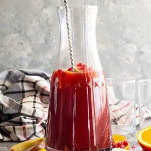 This Pomegranate Apple Cider Sangria is the perfect fall or winter drink! It's even special enough for the holidays! Easy to make non alcoholic too! #drinks #cocktail #Christmascocktail #fallcocktail