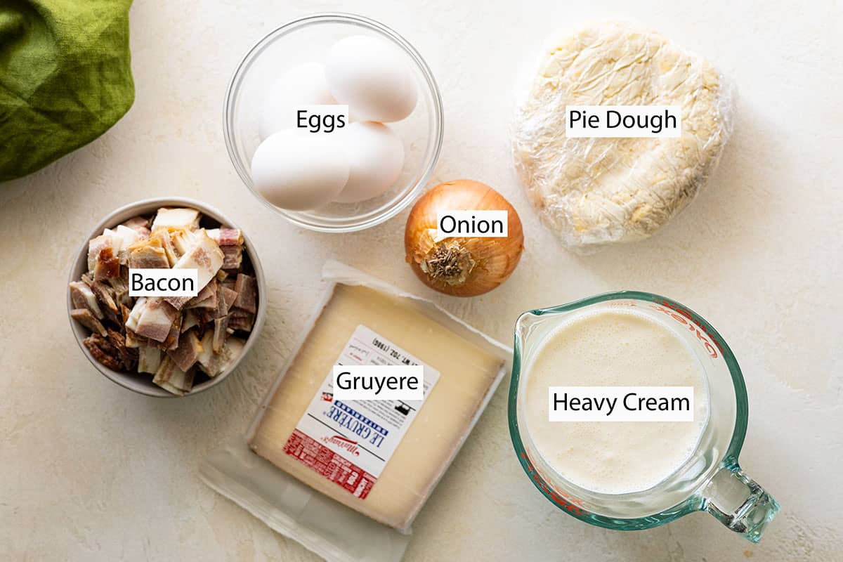 Ingredients: eggs, pie dough, bacon, cheese, onion, and heavy cream. 