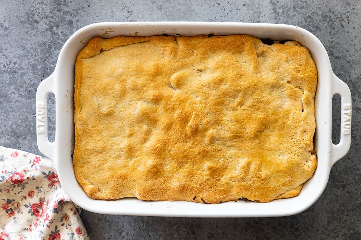 Overhead view of casserole straight from the oven showing the golden color of the dough. 
