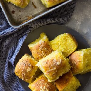 These Savory Pumpkin Rolls will be a great addition to your dinner table. Fluffy light biscuits made with pumpkin, rosemary and Parmesan cheese. | www.countrysidecravings.com