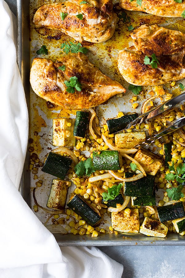 Easy Sheet Pan Mexican Chicken and Vegetables made with fresh corn, zucchini, onion, seasoned to perfection and done in 30 minutes! | www.countrysidecravings.com
