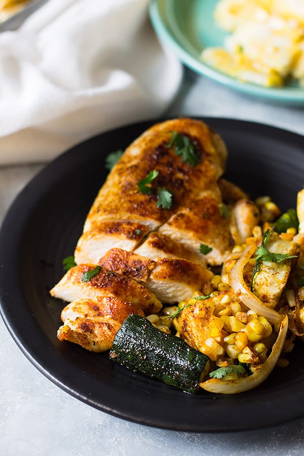 Easy Sheet Pan Mexican Chicken and Vegetables made with fresh corn, zucchini, onion, seasoned to perfection and done in 30 minutes! | www.countrysidecravings.com