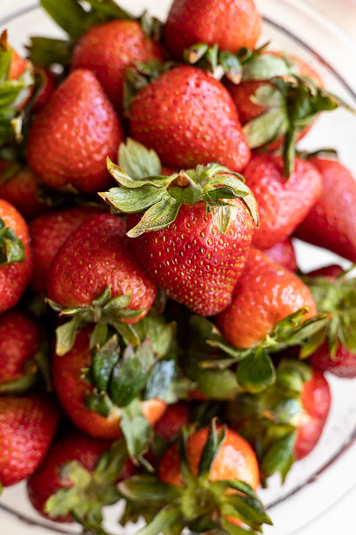 Big bowl of red ripe strawberries.
