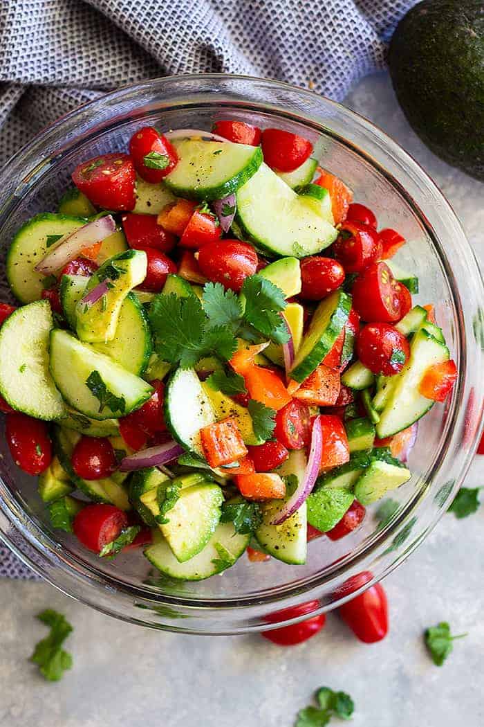 Tomato Cucumber and Avocado Salad -is an easy salad that's light, fresh, full of flavor, and perfect for summer! It's super quick to make and healthy to eat!