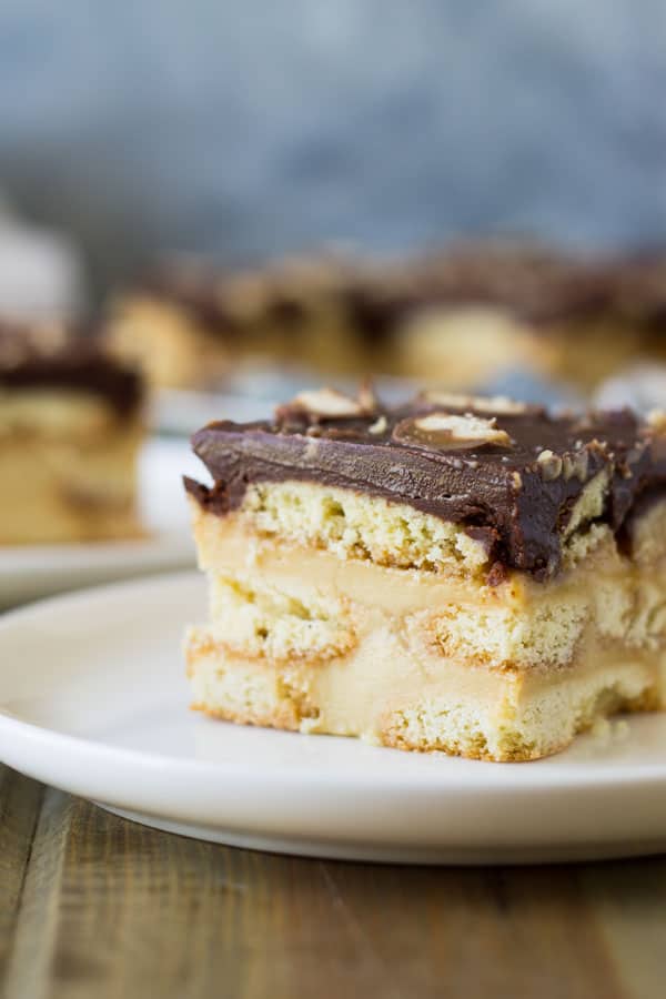 This Twix Icebox Cake is an easy and decadent no-bake cake. Made with homemade pudding, shortbread cookies, caramel and chocolate! | www.countrysidecravings.com